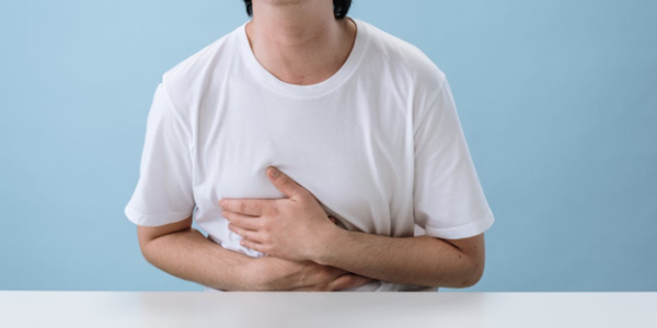 Figure 4. Man suffering from abdominal pain. Source: Pexels.com