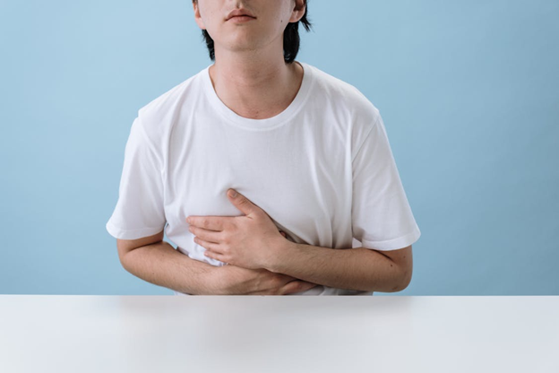 Figure 4. Man suffering from abdominal pain. Source: Pexels.com