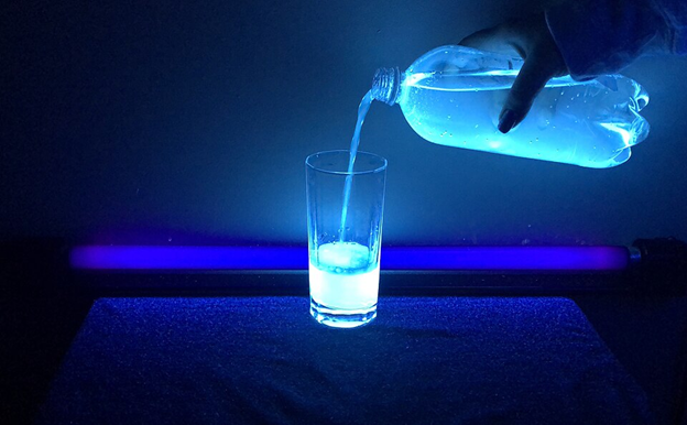 tonic water illuminated by UV light