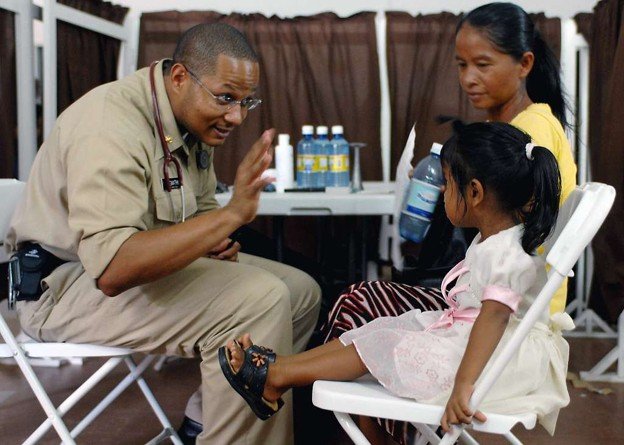 doctor high fiving a patient child